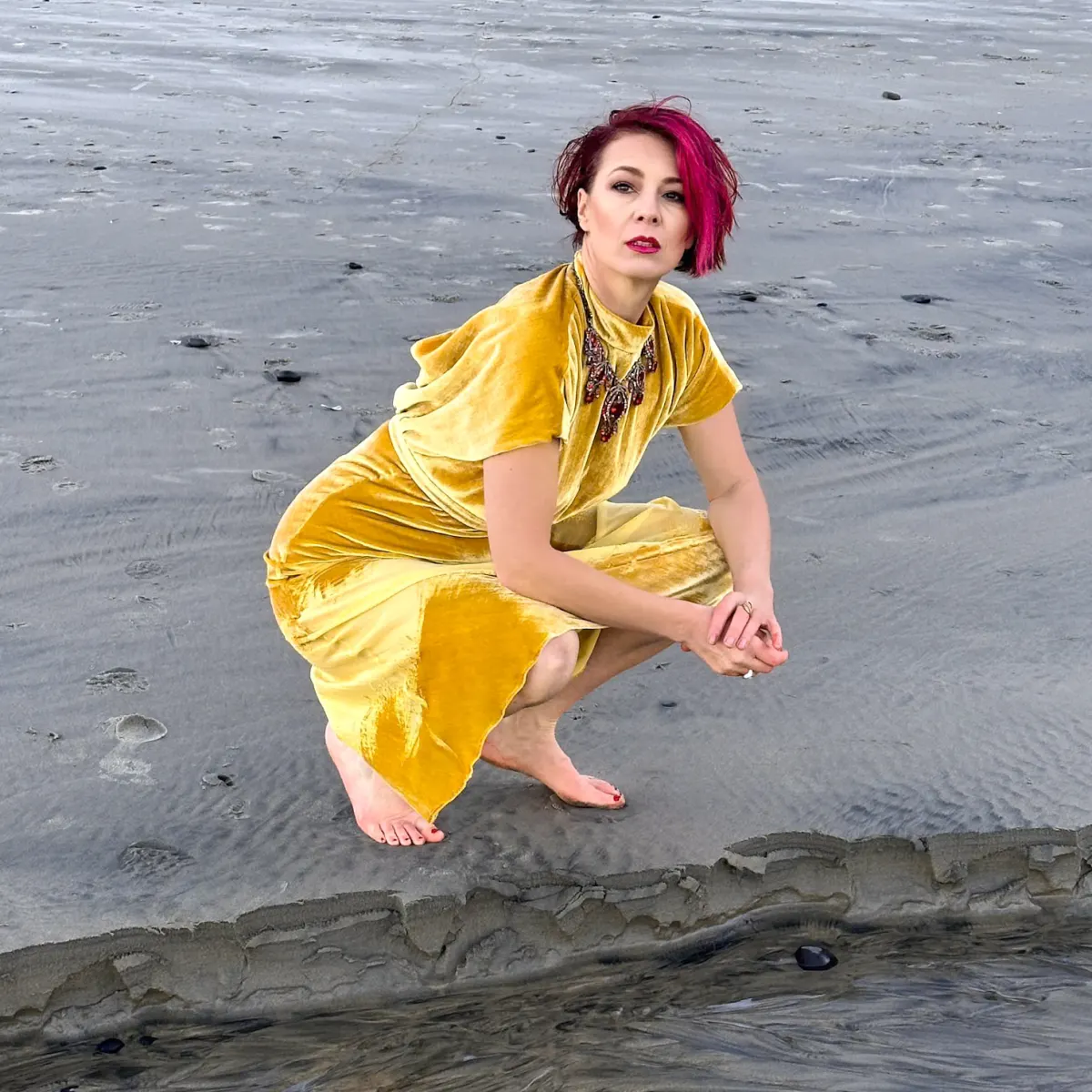 Viktoria crouching in a glamour pose, quiet composed embodiment