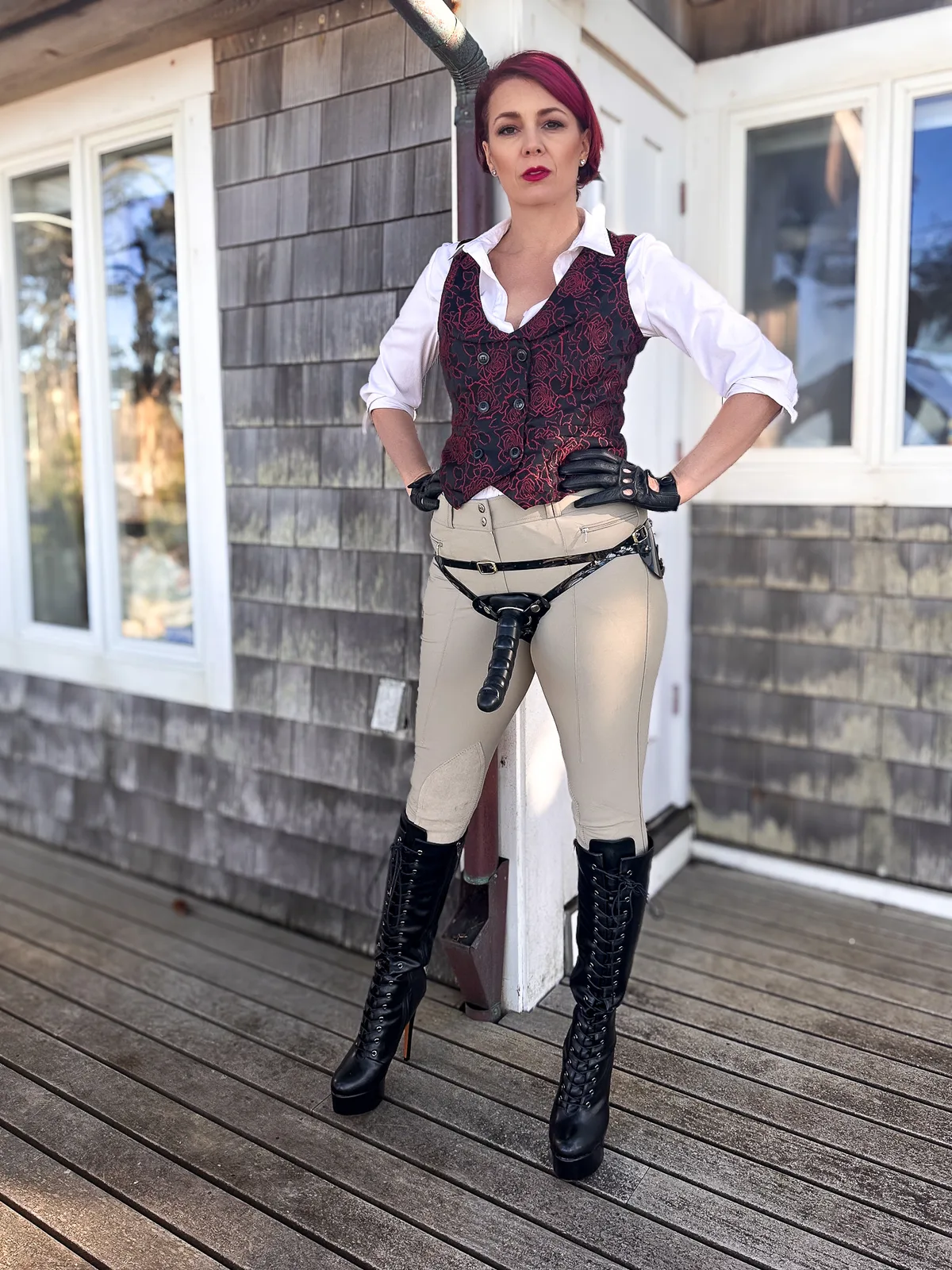 NYC Dominatrix Viktoria Sway in strapon harness and leather boots