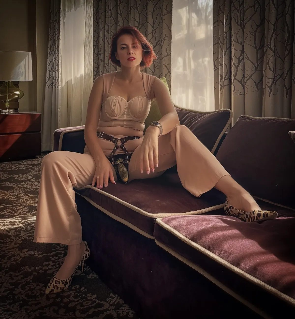 Goddess Viktoria Sway — seated in leather, NYC FemDom