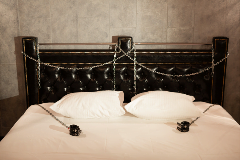 bed with bondage cuffs